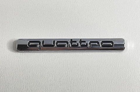 Емблема напис Quattro Audi 65x10mm хром au014 фото товару