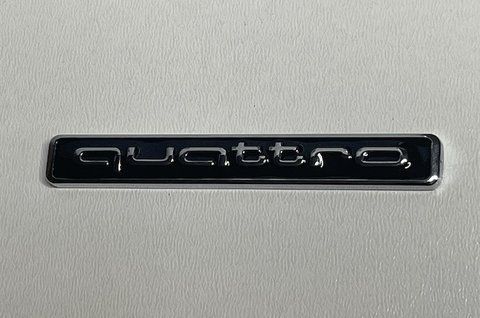 Емблема напис Quattro Audi 65x10mm чорна au021 фото товару